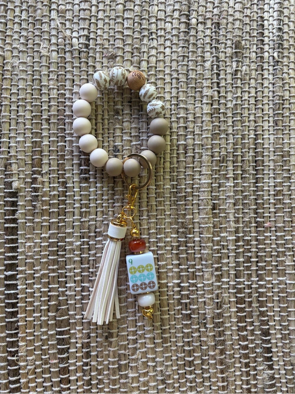 Beaded Wrist Key Chain featuring the 9 Dot Mahjong tile with tassel.